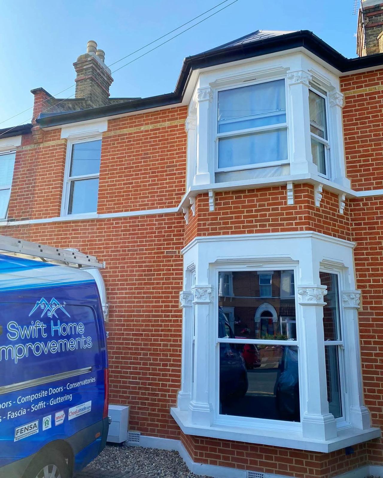 Victorian bay window replacement on a red-brick terrace in Kent with Swift Home Improvements van outside